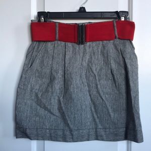 Small grey skirt with red belt